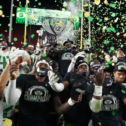 The Oregon Ducks celebrate after defeating the USC