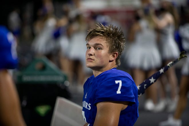 Oconee County Wide Receiver West Weeks (7) watches from the bench during a football game this season. (Photo/Jenn Finch, Athens Banner-Herald)