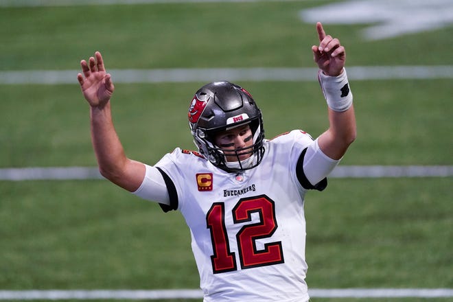 Tampa Bay Buccaneers quarterback Tom Brady celebrates a touchdown against the Falcons during the second half Sunday in Atlanta.