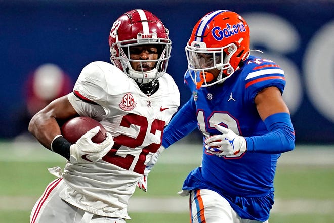 Alabama running back Najee Harris carries against Florida during Saturday's SEC Championship Game in Atlanta. Harris rushed for 178 yards and scored five touchdowns to win MVP honors.