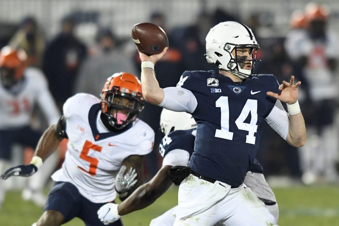 Penn State quarterback Sean Clifford (14) throws a second quarter touchdown pass to wide receiver Jahan Dotson as Illinois linebacker Milo Eifler (5) rushes him during an NCAA college football game in State College, Pa., on Saturday, Dec. 19, 2020. (AP Photo/Barry Reeger)