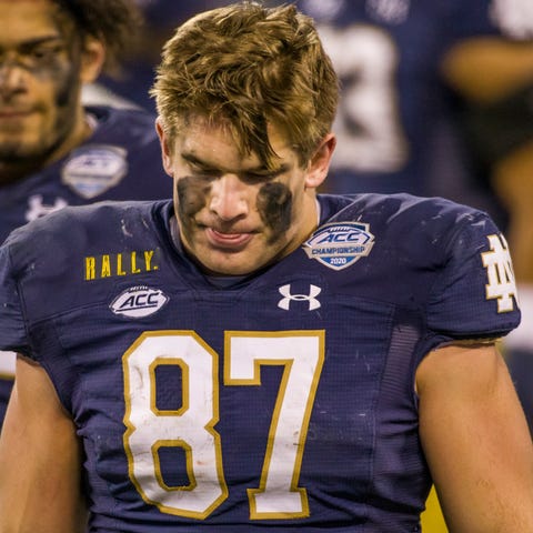 Notre Dame's Michael Mayer (87) walks somberly bac