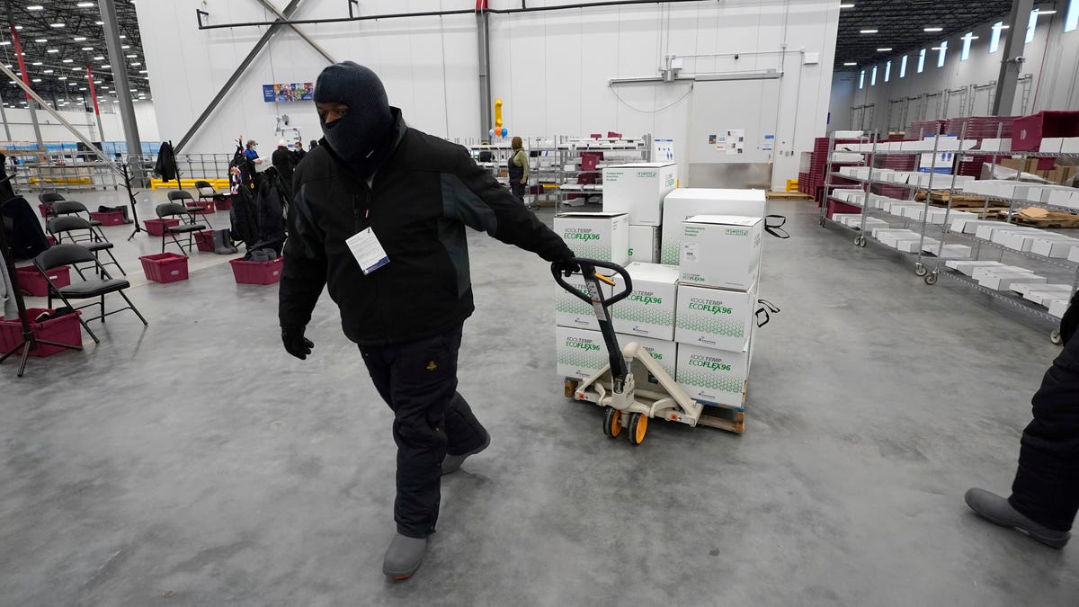 Boxes containing the Moderna COVID-19 vaccine are moved to the loading dock for shipping at the McKesson distribution center in Olive Branch, Miss., Sunday, Dec. 20, 2020. 