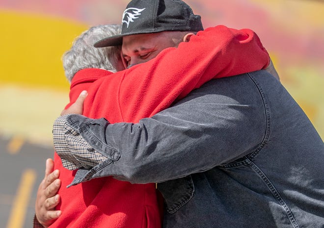 Gunther Aguado hugs Bill Evans last December after Evans gave his 2006 Toyota Highlander to Aguado. In 2019, Aguado spent Christmas Eve under a bridge in San Antonio, homeless because of alcohol addiction. He turned his life around in 2020, with an apartment and a new job. This year, he was able to get a bigger apartment and become certified to drive a forklift with help from Season for Caring.