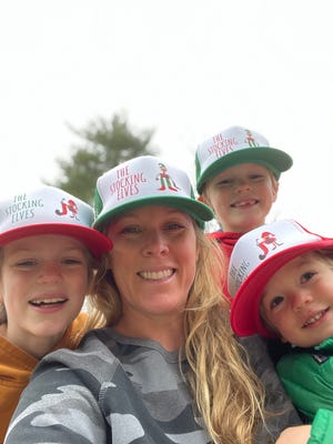 Molly Daniels with her sons, from left, Hunter, Chase and Maverick, have become known as the "Stocking Elves" for their work to provide gifts to Portsmouth area children through Operation Blessing.