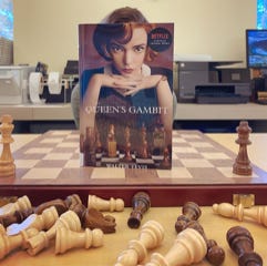 A resident having fun with the Weston Library's popular “Book Face” display.