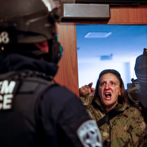 A right-wing protester screams at Salem Police as 