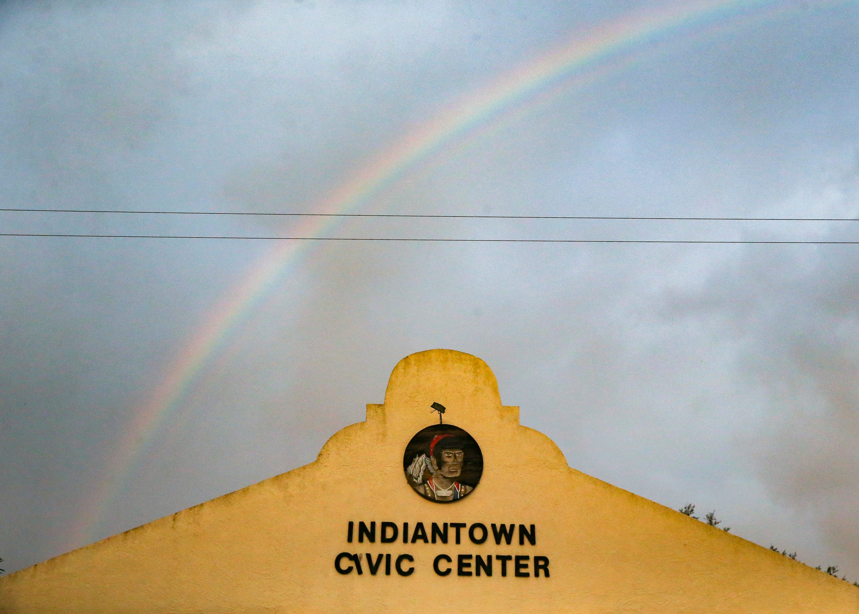 A rainbow appears behind the Indiantown Civic Center building after a storm on Saturday, Dec. 12, 2020, in Indiantown. 