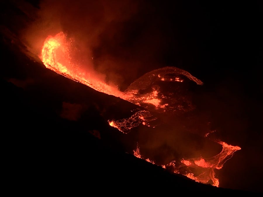 In this photo provided by the U.S. Geological Survey, lava flows within the Halema'uma'u crater of the Kilauea volcano Sunday, Dec. 20, 2020. The Kilauea volcano on Hawaii's Big Island has erupted, the U.S. Geological Survey said.