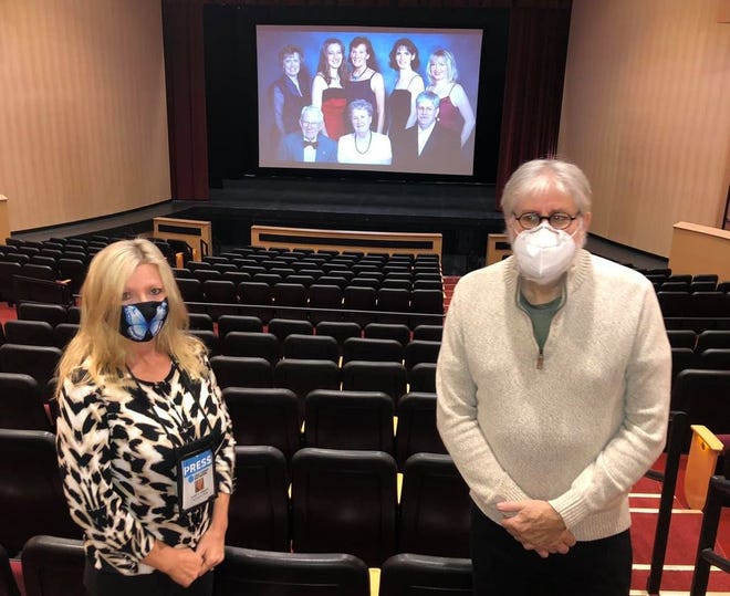 The Social Butterfly Kristi K. Higgins and Mark Fausz stand in the Jimmy Dean Theater in front of a photo by photographer Jeff Bowman of the original Perkinson Center for the Arts and Education board on Dec. 19, 2020 in Chester. Back row from left to right: AnnTotty, Pam Bishop, Pat Dodd, Julia Bowman, Kristi K. Higgins. Front row from left to right: the late Elton Beverly, the late Betty Matthews, and Mark Fausz.