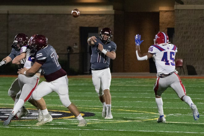 Benedictine’s Holden Geriner throws for a touchdown to Za'Quan Bryan in a playoff game against Jefferson last season.