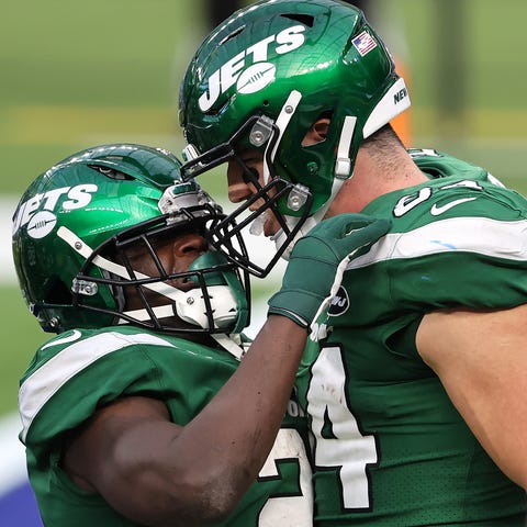 The Jets' Ryan Griffin (right) congratulates Frank