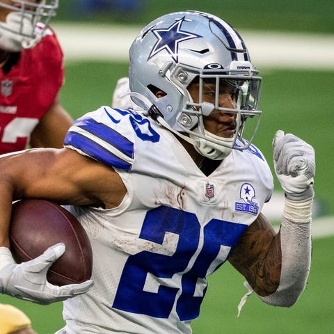 Dallas Cowboys' Tony Pollard scores against the  4