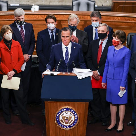 Sen. Mitt Romney (R-UT) speaks alongside a biparti