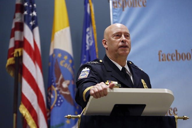 Interim Columbus Police Chief Thomas Quinlan talks to other members of the Columbus police force and families that had gathered for his swearing in ceremony as well as new sergeants and a lieutenant at police headquarters in Columbus February 8, 2019. He resigned on Jan. 28, 2021 after Columbus Mayor Andrew Ginther asked him to leave. [Eric Albrecht/Dispatch]