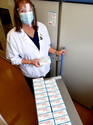 Pharmacy Technician Valerie Destito receives the first shipment of the Moderna COVID-19 vaccine at Rome Memorial Hospital on Tuesday, Dec. 22, 2020.