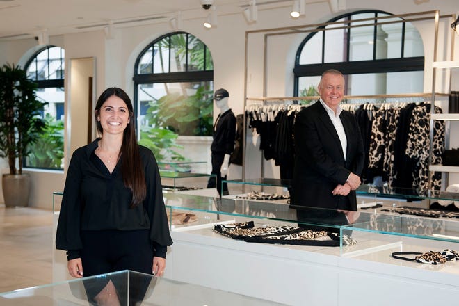 Rachel Kaslow is the buyer manager of SHAN, a resort wear boutique by The Breakers that opened at Via Flagler on Wednesday. With her is John Zoller, the Breakers' senior vice president of retail operations. MEGHAN McCARTHY / Palm Beach Daily News
