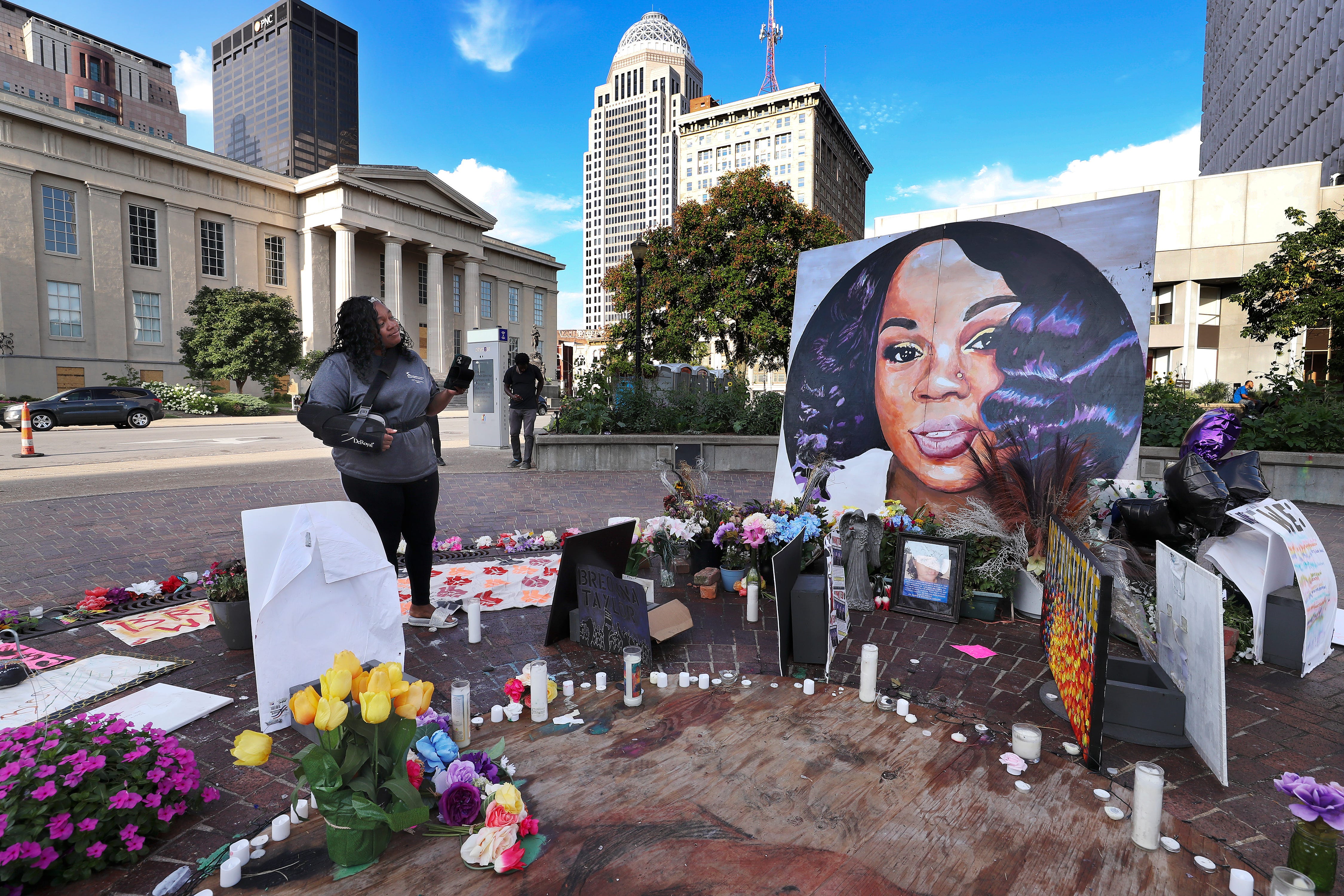 Tamika Palmer admires a large painting of her daughter Breonna Taylor displayed inside "Breonna's Circle" at Jefferson Square Park on Aug. 5, 2020. Taylor died at the hands of Louisville Metro Police Department as officers issued a no-knock warrant at her apartment.