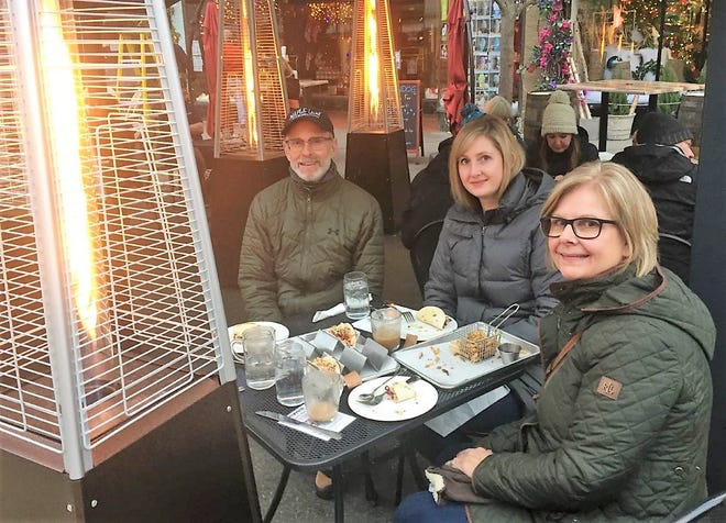 The Jezowski family, from left, Dan, Rachel and Dawn, enjoy an outdoor meal at the Browndog Barlor & Restaurant.