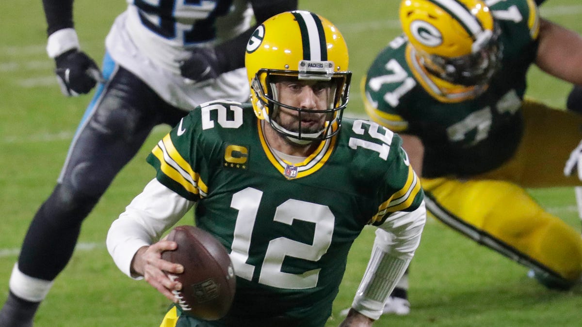 Packers quarterback Aaron Rodgers is having a season worthy of an MVP. If he wins, it would be his third, and he would join an elite group.