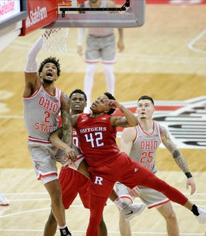 Ohio State Buckeyes guard Musa Jallow (2) is fouled by Rutgers Scarlet Knights guard Jacob Young (42) during the second half of Wednesday's NCAA Division I basketball game at Value City Arena in Columbus, Oh. on December 23, 2020.