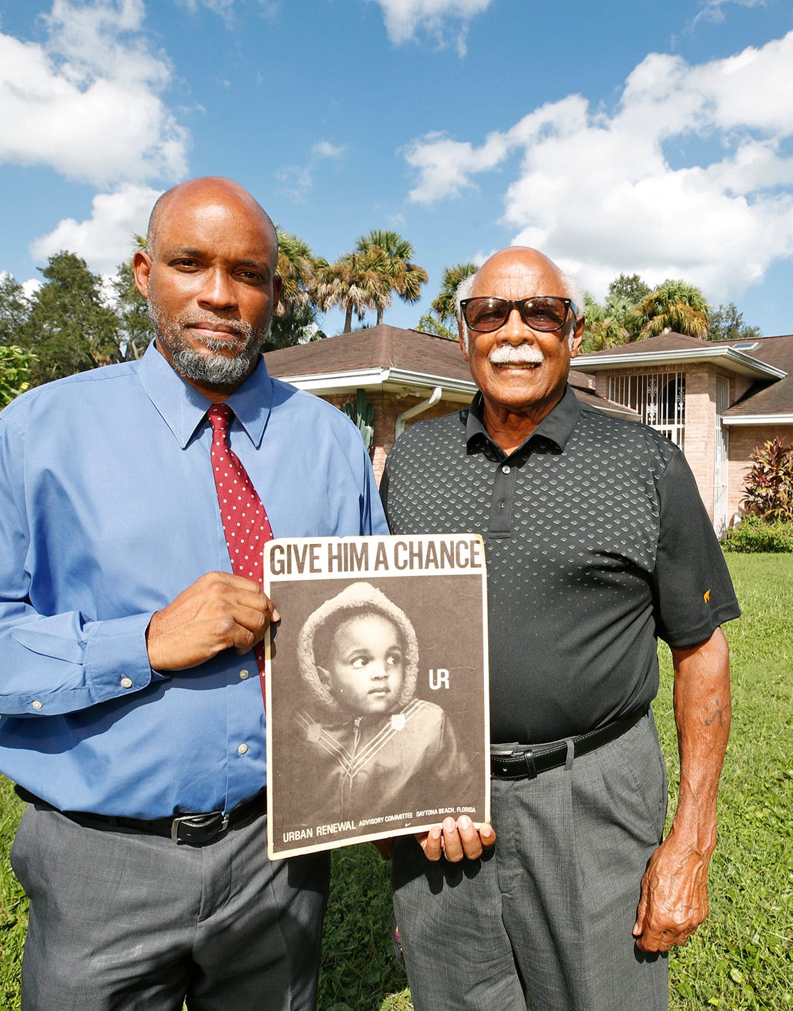 David Lucas, left, unwittingly became the poster child for urban renewal in the early 1960s when he was a small child. His father, Harold Lucas, at right, was shopping for fishing poles in Sears on Beach Street when a man asked if it was OK if he photographed his son. The elder Lucas said OK, not realizing the photographer was a government official involved in the urban renewal program that wound up leveling many homes and businesses in Midtown.