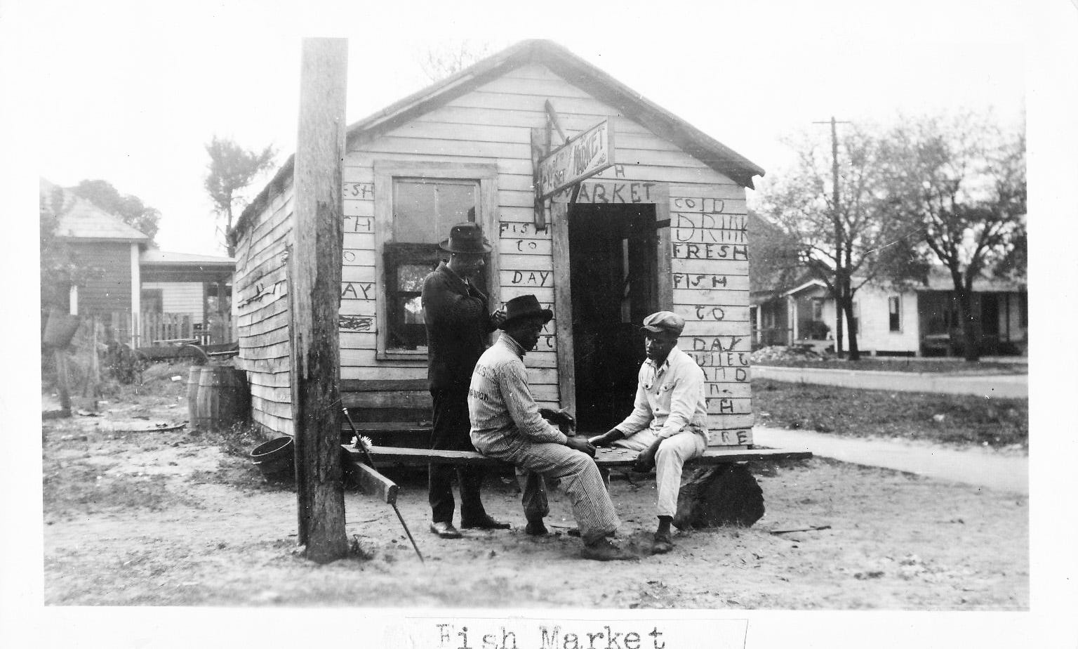 Poverty has always been a part of Daytona Beach's Midtown neighborhood, but residents in the early 1900s made the best of their fate and created a community where people helped one another survive. This scene of two men playing checkers in front of a ramshackle fish market building was shot in 1943.