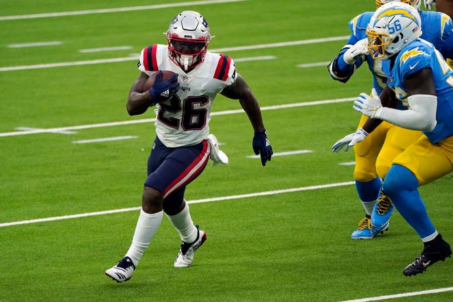 New England Patriots running back Sony Michel (left) runs against the Los Angeles Chargers during the second half of an NFL football game on Dec. 6, 2020, in Inglewood, Calif.