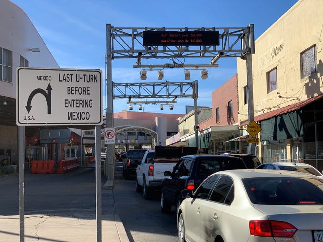 Cars with U.S. travelers line up at the DeConcini border crossing to travel south into Mexico on Dec. 17, 2020, despite restrictions on non-essential travel.