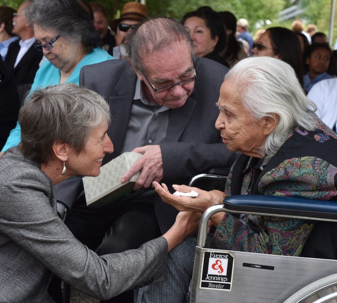 In this July 19, 2016 file photo Hank Adams, center, looks on as U.S. Interior Secretary Sally Jewell, left, greets 92 year-old Maiselle Bridges, right, during the celebration of the renaming of Nisqually National Wildlife Refuge near Olympia, Wash.  Henry "Hank" Adams, Assiniboine-Sioux, died Dec. 21, 2020.