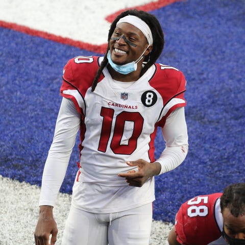 DeAndre Hopkins walks off the field after the Card