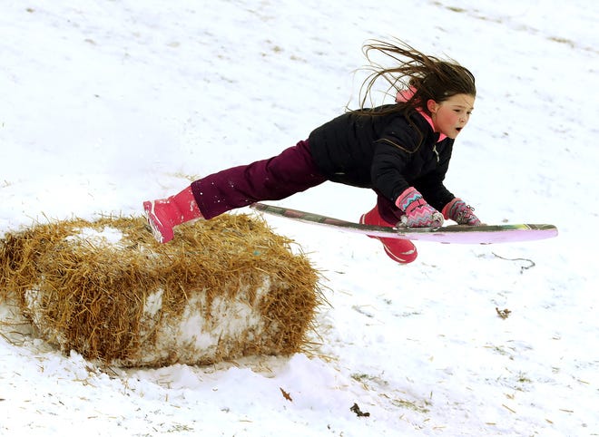 A sledder gets some air as she goes over a ramp on Christmas Day 2020 at Alum Creek Park North in Westerville. Columbus typically has a 10-25% chance for a white Christmas, according to a meteorologist for the National Weather Service.