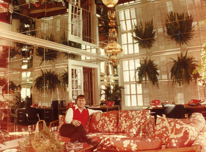 B.J. Marsh sits for a portrait to go with a 1983 profile on his dazzling, mirror-filled house modeled off Elvis' Graceland.
