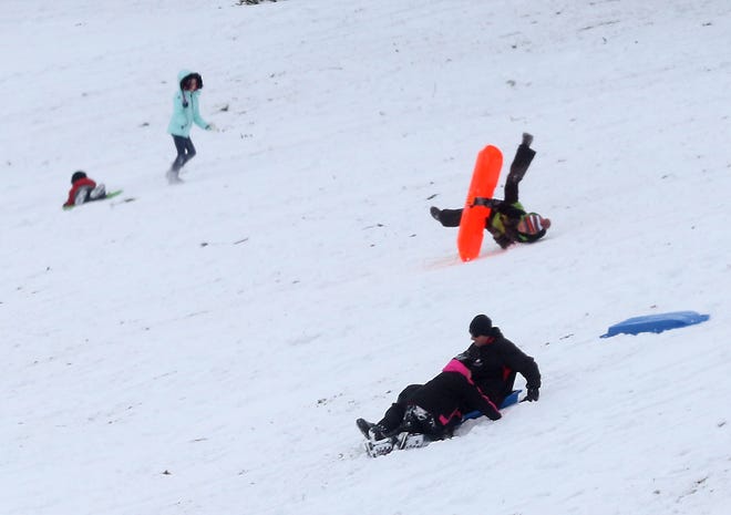 People brave the weather Saturday to go sledding on Deis Hill in Dover. Check out our gallery of fun in the snow at TimesReporter.com.