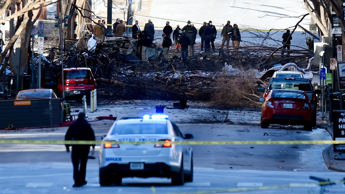 ATF and law enforcement members investigate the Christmas Day explosion on Saturday, December 26, 2020 in Nashville, Tenn. Authorities believe an RV parked on Second Ave. caused the explosion in an 