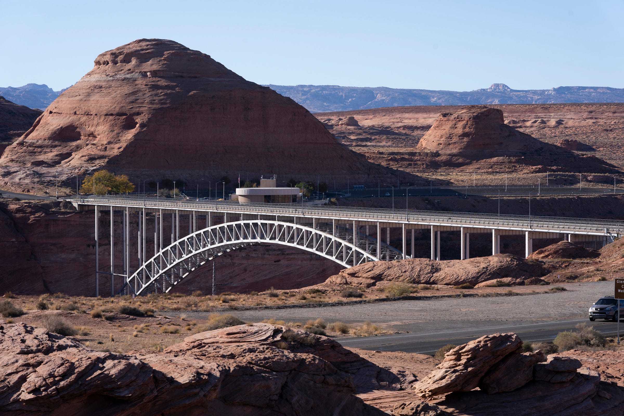 Glen Canyon Bridge crosses the Colorado River next to Glen Canyon Dam and Lake Powell.