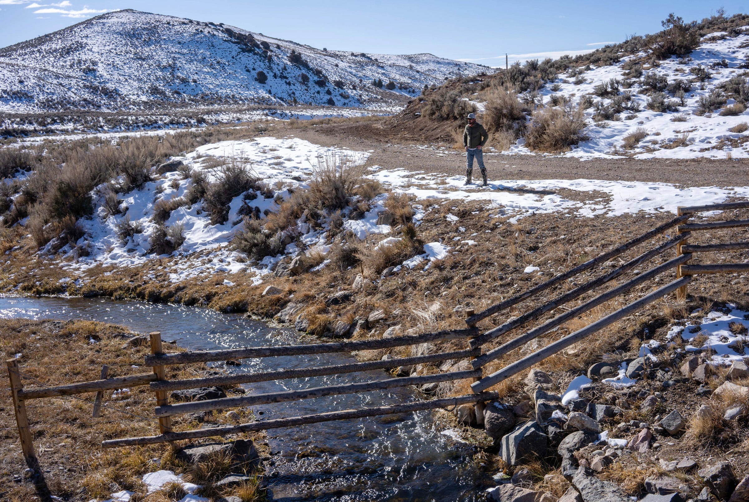 Rancher Paul Bruchez stands beside Reeder Creek, which flows into the Colorado River near Kremmling, Colorado.