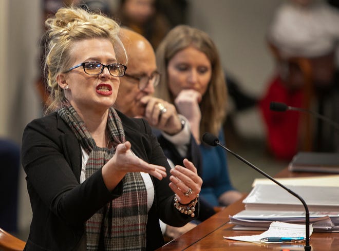 Witness Melissa Carone speaks at left as President Trump's attorney Rudy Giuliani questions witnesses regarding alleged election irregularities in front of the Michigan House Oversight Committee Wednesday, Dec. 2, 2020 during a meeting in the Anderson House Office Building in Lansing.