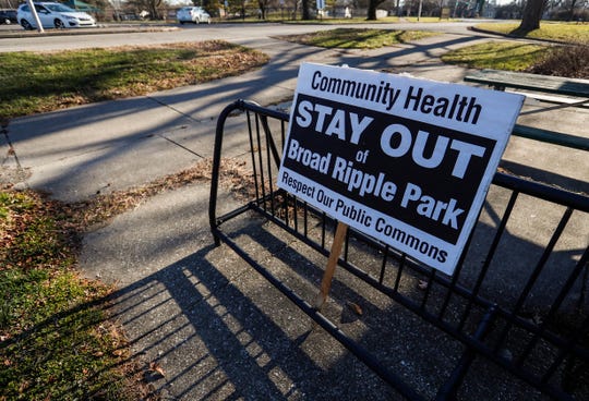 A sign reads "Community Health stay out of Borad Ripple Park. Respect our public commons," at the The Broad Ripple Park Family Center off of Broad Ripple Avenue on Tuesday, Dec. 22, 2020. 