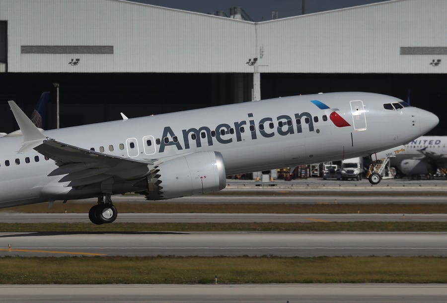American Airlines Flight 718, a Boeing 737 Max, takes off from Miami International Airport on its way to New York on Dec. 29. The Boeing 737 Max flew its first commercial flight since the aircraft was allowed to return to service nearly two years after being grounded worldwide following a pair of crashes.