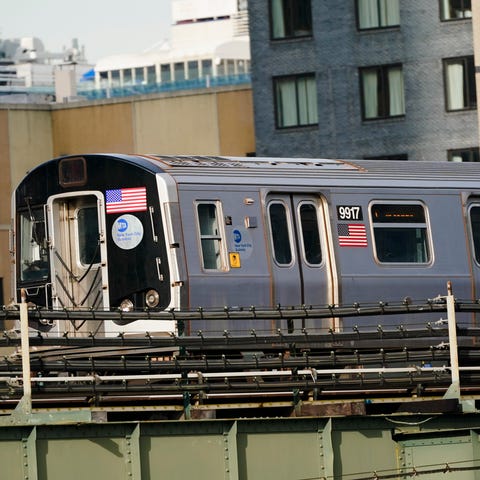 An N train moves through the Long Island City neig