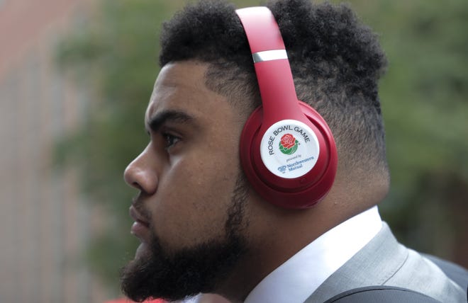 Ohio State Buckeyes defensive tackle Haskell Garrett sports a pair of Rose Bowl headphones as he arrives with the Ohio State Buckeyes before a NCAA Division I football game between the Nebraska Cornhuskers and the Ohio State Buckeyes on Saturday, September 28, 2019 at Memorial Stadium in Lincoln, Nebraska. [Joshua A. Bickel/Dispatch]