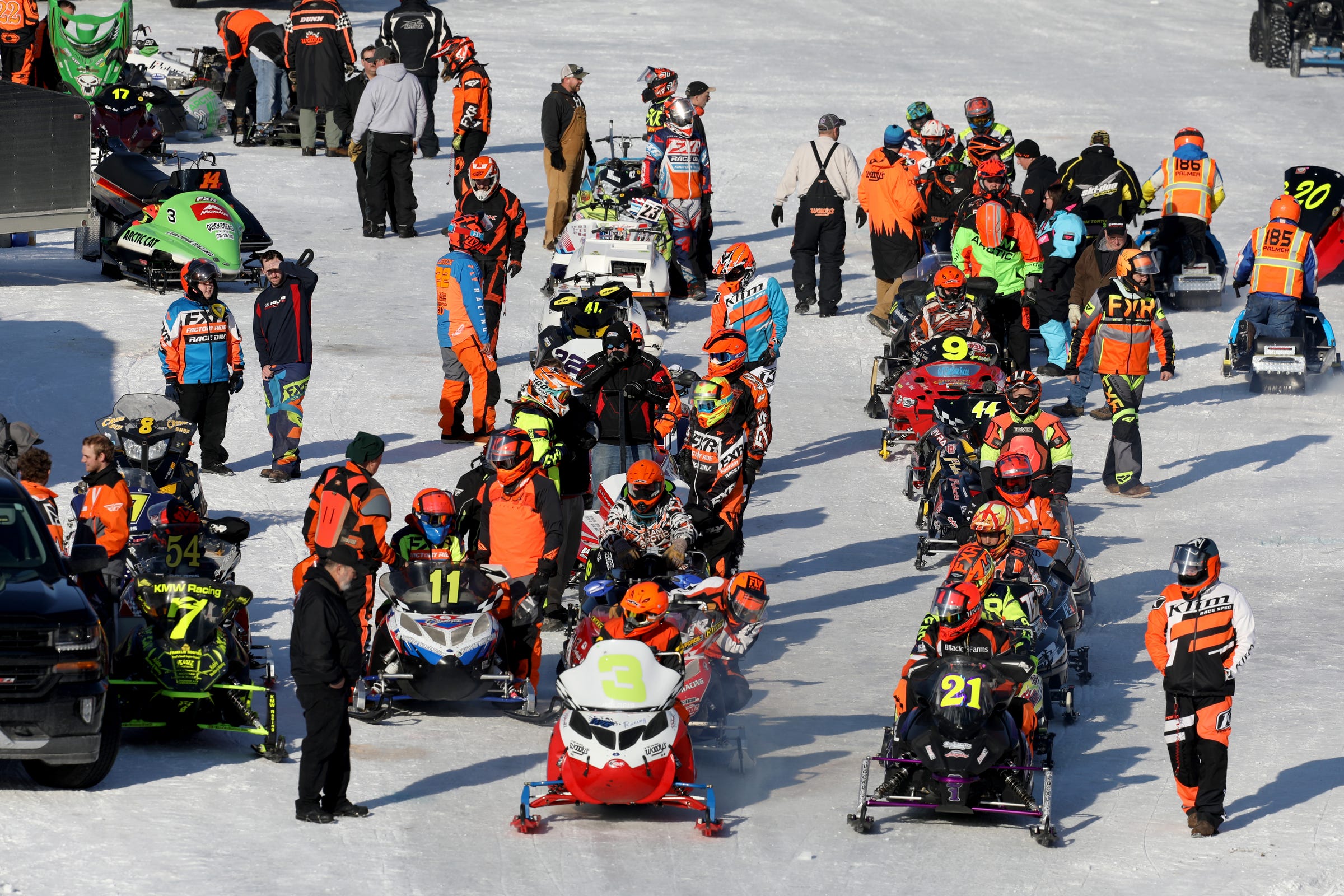 Snowmobile racers line up before heading out on the oval track for more racing during the Midwest International Racing Association FireRite 250 at the Alcona County Recreation Area in Lincoln, MI on Saturday, Feb. 22, 2020.
With the warm weather during most of the winter the track was much slower as the snowmobiles had to race through the slush when they prefer and go much faster on packed snow and ice.