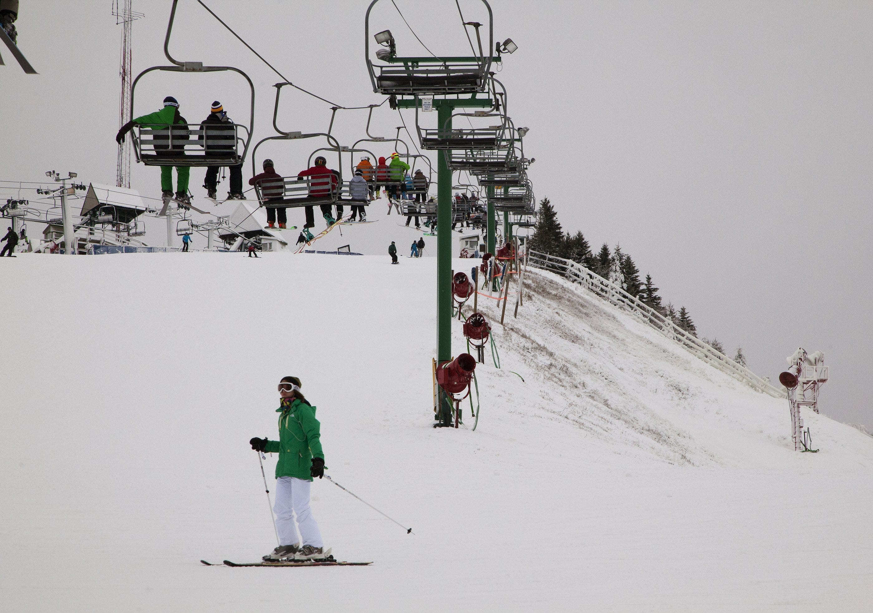 Skiers make their way up a lift while skiing at Pine Knob in Clarkston on Wednesday, December 26th, 2012.