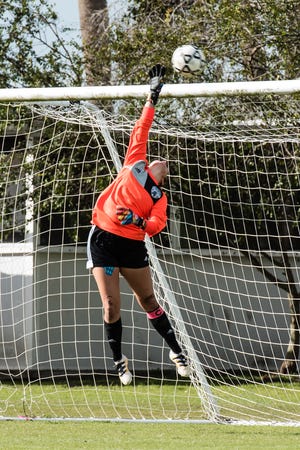 Johnson University women’s soccer team goalie Jailie Bullock blocks a goal.