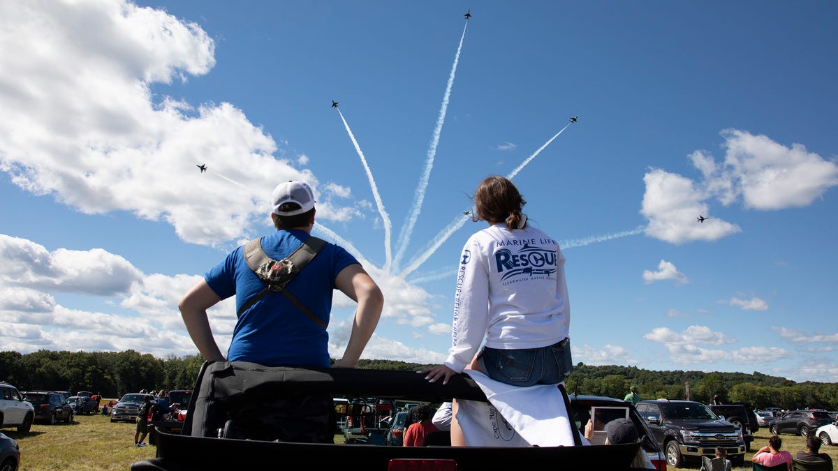 Dan and Marissa Albano watch the Thunderbirds from the back of their Jeep at the New York International Air Show at Orange County Airport on Sunday, August 30, 2020.