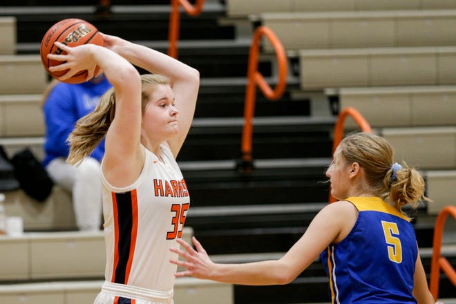 Harrison's Haley Thomas (35) looks to pass the ball as she is guarded by North White's Olivia Allen (5) during the first quarter of an IHSAA girls basketball game, Wednesday, Dec. 30, 2020 in West Lafayette.