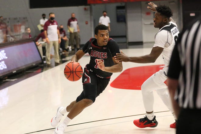 Junior guard Jason King drives toward the rim during New Mexico State's game against Cal State Northridge on Dec. 28, 2020, in Northridge, California.