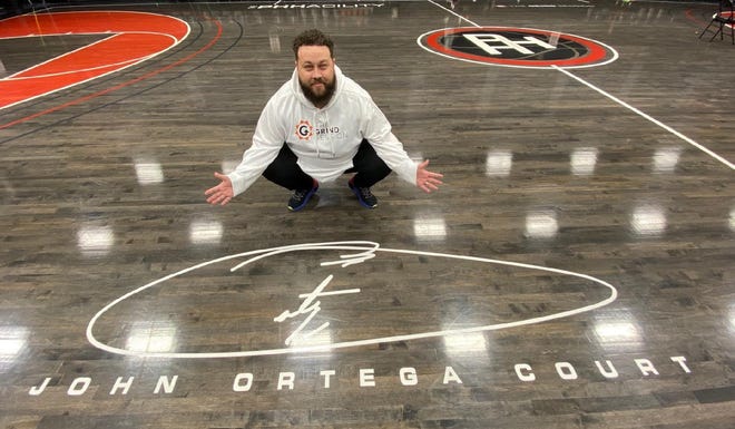 PHH Prep boys basketball director John Ortega was given the greatest Christmas gift with the main court at the privately-owned Phhacility named after him. Photo courtesy of PHH Prep.