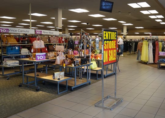 A sign reading, ' Entire Store on Sale,' at the entrance to a Stein Mart store on Aug. 12 in Miami, Florida.